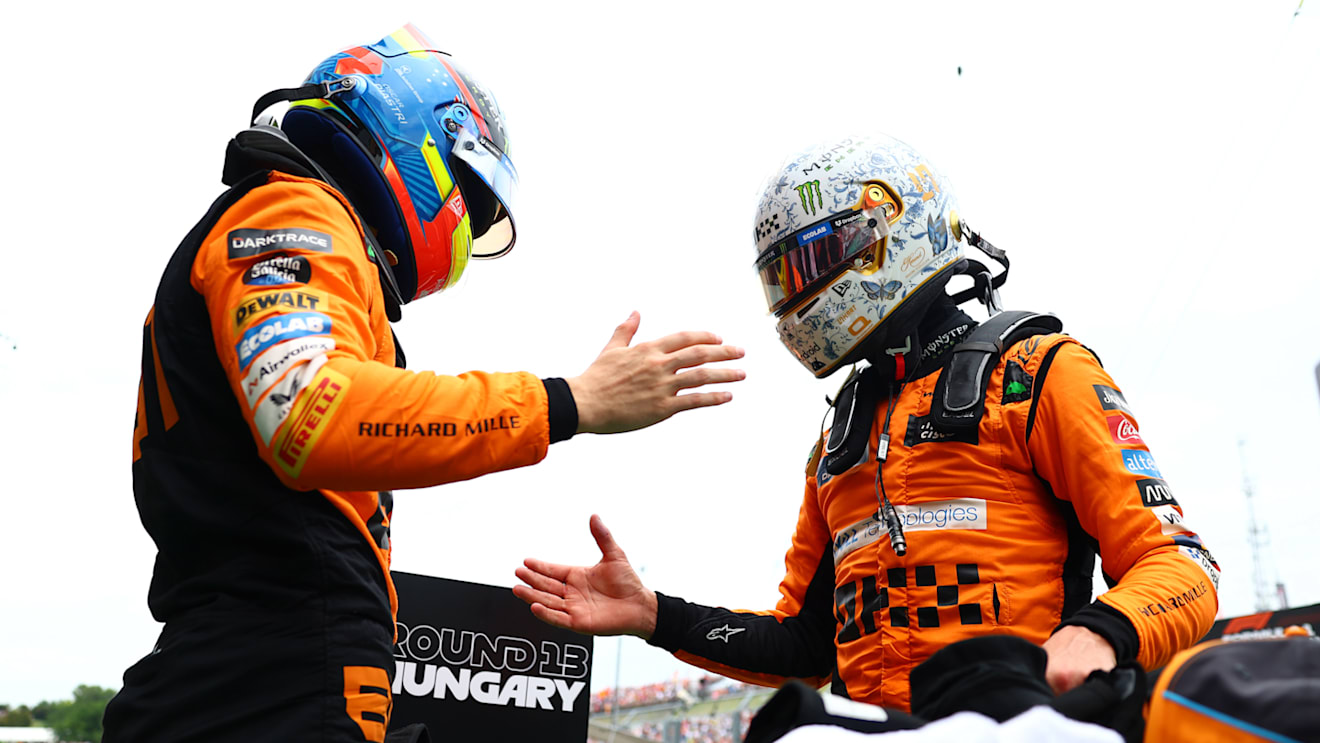 BUDAPEST, HUNGARY - JULY 20: Pole position qualifier Lando Norris of Great Britain and McLaren and Second placed qualifier Oscar Piastri of Australia and McLaren celebrate in parc ferme during qualifying ahead of the F1 Grand Prix of Hungary at Hungaroring on July 20, 2024 in Budapest, Hungary. (Photo by Bryn Lennon - Formula 1/Formula 1 via Getty Images)