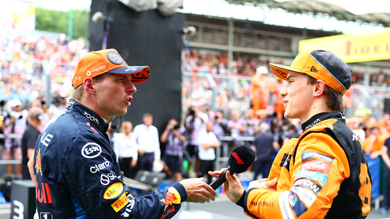 BUDAPEST, HUNGARY - JULY 20: Third placed qualifier Max Verstappen of the Netherlands and Oracle Red Bull Racing and Second placed qualifier Oscar Piastri of Australia and McLaren talk in parc ferme during qualifying ahead of the F1 Grand Prix of Hungary at Hungaroring on July 20, 2024 in Budapest, Hungary. (Photo by Bryn Lennon - Formula 1/Formula 1 via Getty Images)