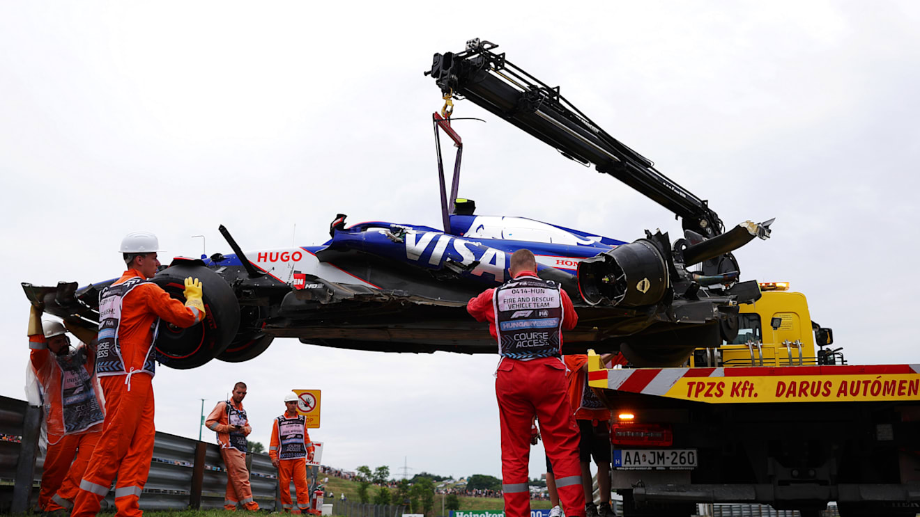 BUDAPEST, HUNGARY - JULY 20: The car of Yuki Tsunoda of Japan and Visa Cash App RB is recovered from the circuit after a crash during qualifying ahead of the F1 Grand Prix of Hungary at Hungaroring on July 20, 2024 in Budapest, Hungary. (Photo by Dean Mouhtaropoulos/Getty Images)