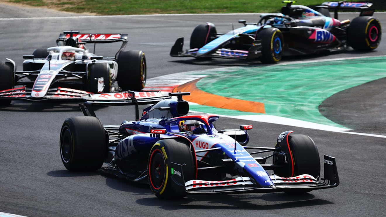 MONZA, ITALY - SEPTEMBER 01: Daniel Ricciardo of Australia driving the (3) Visa Cash App RB VCARB 01 leads Kevin Magnussen of Denmark driving the (20) Haas F1 VF-24 Ferrari on track during the F1 Grand Prix of Italy at Autodromo Nazionale Monza on September 01, 2024 in Monza, Italy. (Photo by Mark Thompson/Getty Images)