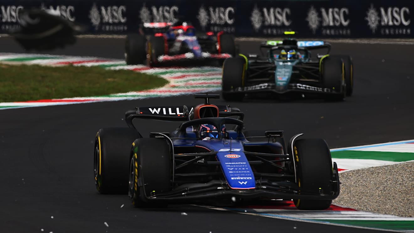 MONZA, ITALY - SEPTEMBER 01: Alexander Albon of Thailand driving the (23) Williams FW46 Mercedes leads Fernando Alonso of Spain driving the (14) Aston Martin AMR24 Mercedes on track during the F1 Grand Prix of Italy at Autodromo Nazionale Monza on September 01, 2024 in Monza, Italy. (Photo by Rudy Carezzevoli/Getty Images)