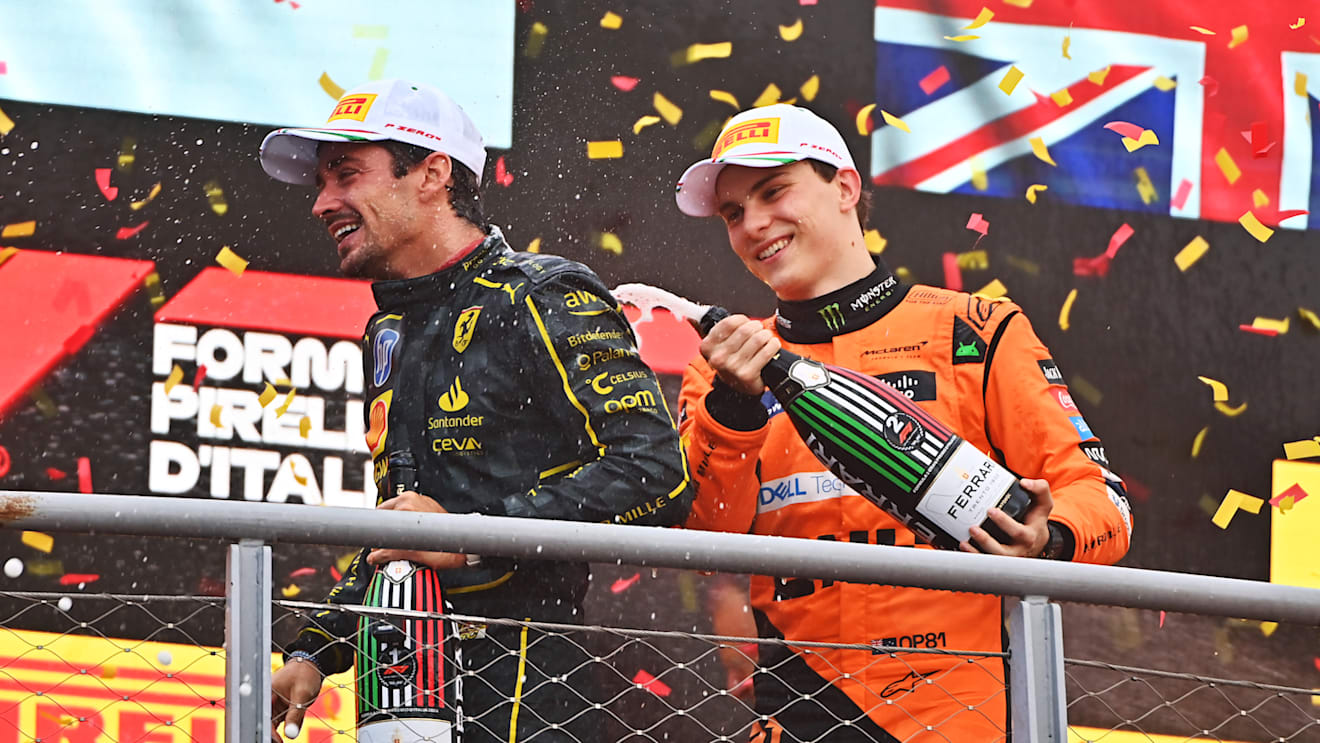 MONZA, ITALY - SEPTEMBER 01: Race winner Charles Leclerc of Monaco and Ferrari and Second placed Oscar Piastri of Australia and McLaren celebrates on the podium during the F1 Grand Prix of Italy at Autodromo Nazionale Monza on September 01, 2024 in Monza, Italy. (Photo by James Sutton - Formula 1/Formula 1 via Getty Images)