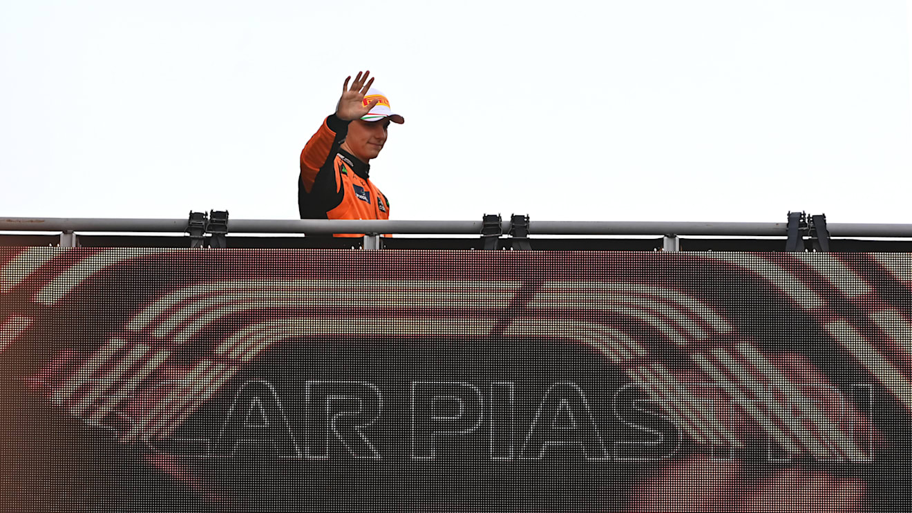 MONZA, ITALY - SEPTEMBER 01: Oscar Piastri of Australia and McLaren waves to fans as he walks to the podium during the F1 Grand Prix of Italy at Autodromo Nazionale Monza on September 01, 2024 in Monza, Italy. (Photo by James Sutton - Formula 1/Formula 1 via Getty Images)