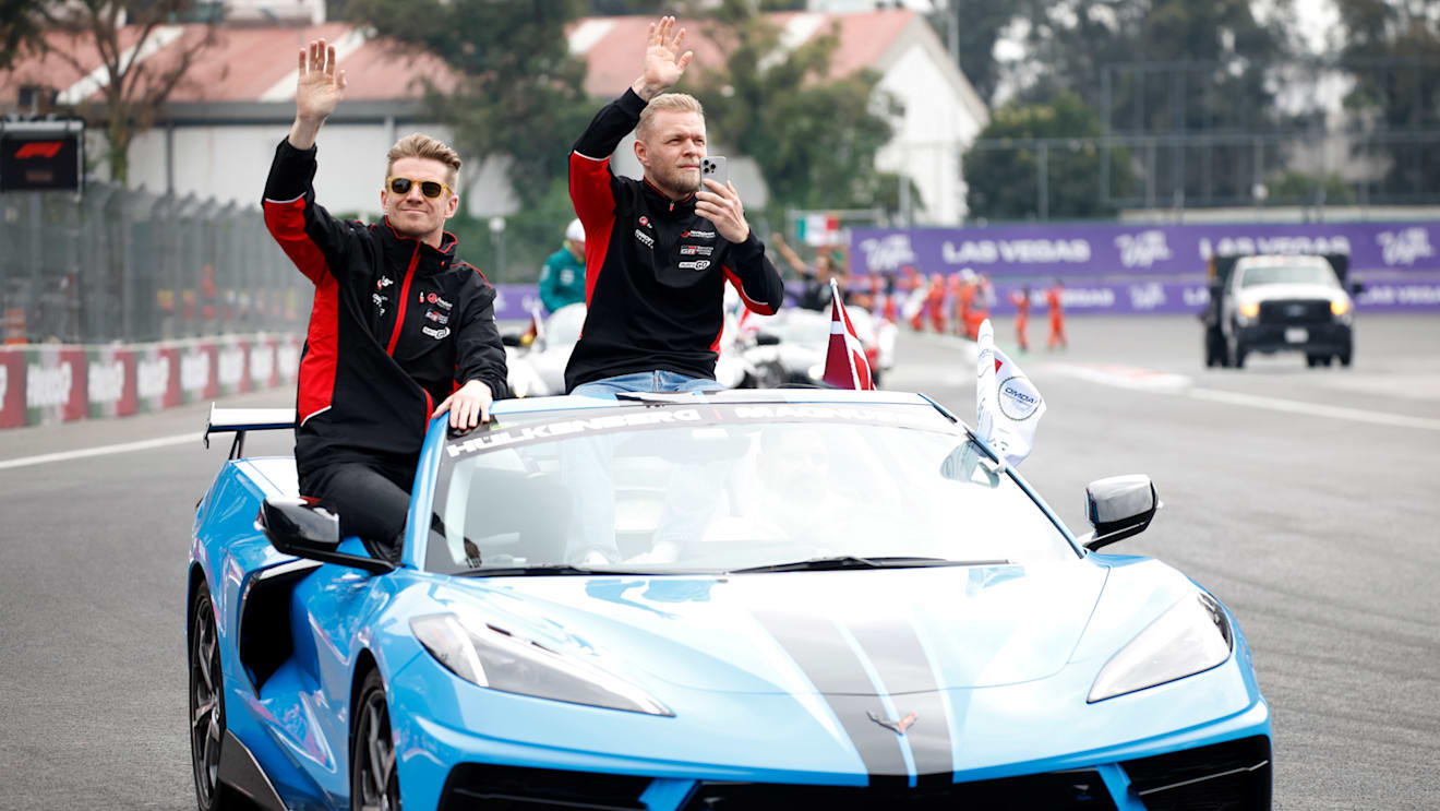 MEXICO CITY, MEXICO - OCTOBER 27: Nico Hulkenberg of Germany and Haas F1 and Kevin Magnussen of Denmark and Haas F1 wave to the crowd on the drivers parade prior to the F1 Grand Prix of Mexico at Autodromo Hermanos Rodriguez on October 27, 2024 in Mexico City, Mexico. (Photo by Chris Graythen/Getty Images)