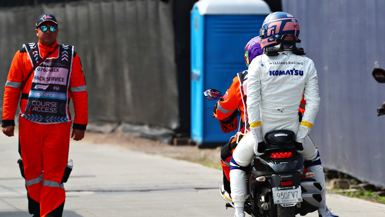 MEXICO CITY, MEXICO - OCTOBER 27: Alexander Albon of Thailand and Williams takes a ride on a bike after crashing at the start during the F1 Grand Prix of Mexico at Autodromo Hermanos Rodriguez on October 27, 2024 in Mexico City, Mexico. (Photo by Peter Fox - Formula 1/Formula 1 via Getty Images)