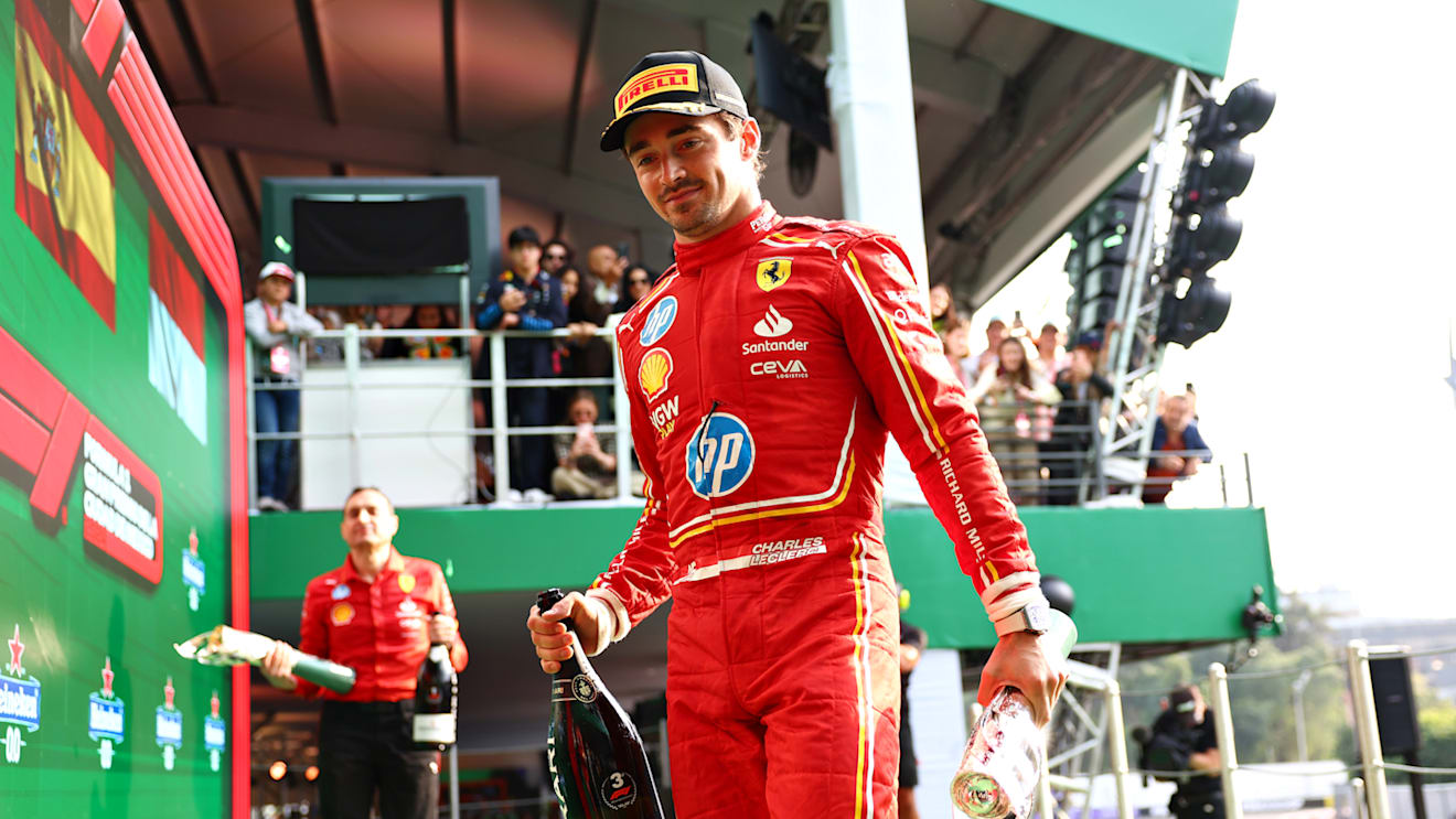 MEXICO CITY, MEXICO - OCTOBER 27: Third placed Charles Leclerc of Monaco and Ferrari on the podium after the F1 Grand Prix of Mexico at Autodromo Hermanos Rodriguez on October 27, 2024 in Mexico City, Mexico. (Photo by Bryn Lennon - Formula 1/Formula 1 via Getty Images)