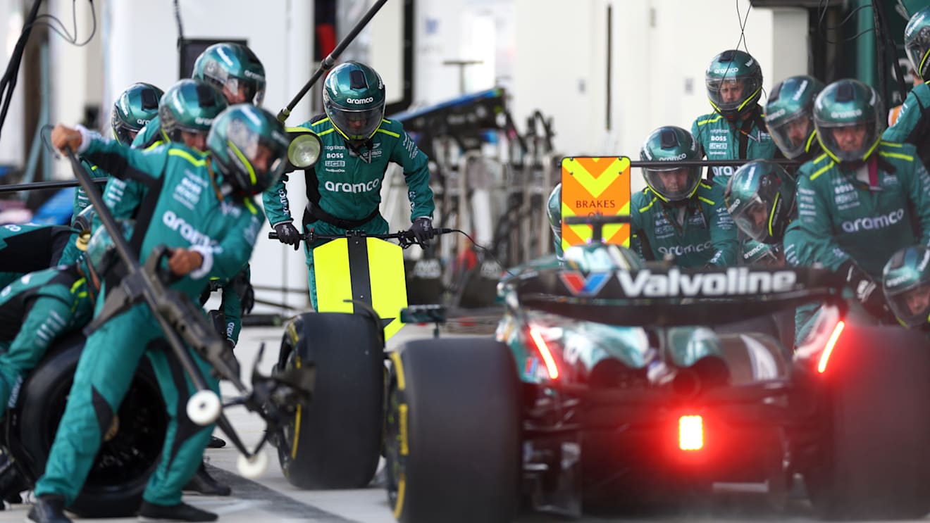 MIAMI, FLORIDA - MAY 05: Lance Stroll of Canada driving the (18) Aston Martin AMR24 Mercedes makes a pit stop during the F1 Grand Prix of Miami at Miami International Autodrome on May 04, 2024 in Miami, Florida. (Photo by Clive Rose - Formula 1/Formula 1 via Getty Images)