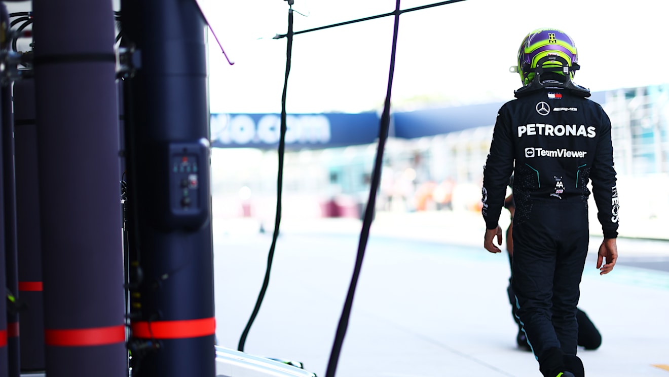 MIAMI, FLORIDA - MAY 03: 12th placed qualifier Lewis Hamilton of Great Britain and Mercedes walks in the Pitlane during Sprint Qualifying ahead of the F1 Grand Prix of Miami at Miami International Autodrome on May 03, 2024 in Miami, Florida. (Photo by Mark Thompson/Getty Images)