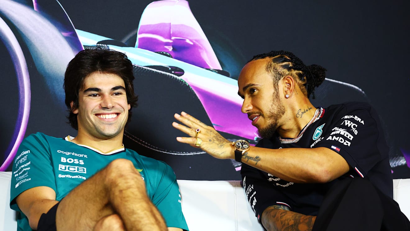 MIAMI, FLORIDA - MAY 02: Lance Stroll of Canada and Aston Martin F1 Team and Lewis Hamilton of Great Britain and Mercedes talk in the Drivers Press Conference during previews ahead of the F1 Grand Prix of Miami at Miami International Autodrome on May 02, 2024 in Miami, Florida. (Photo by Clive Rose/Getty Images)