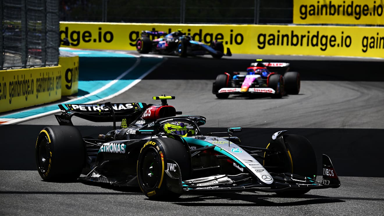 MIAMI, FLORIDA - MAY 04: Lewis Hamilton of Great Britain driving the (44) Mercedes AMG Petronas F1 Team W15 leads Yuki Tsunoda of Japan driving the (22) Visa Cash App RB VCARB 01 during the Sprint ahead of the F1 Grand Prix of Miami at Miami International Autodrome on May 04, 2024 in Miami, Florida. (Photo by Clive Mason/Getty Images)