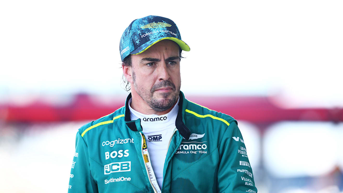 MIAMI, FLORIDA - MAY 04: 15th placed qualifier Fernando Alonso of Spain and Aston Martin F1 Team walks in the Pitlane during qualifying ahead of the F1 Grand Prix of Miami at Miami International Autodrome on May 04, 2024 in Miami, Florida. (Photo by Clive Rose - Formula 1/Formula 1 via Getty Images)