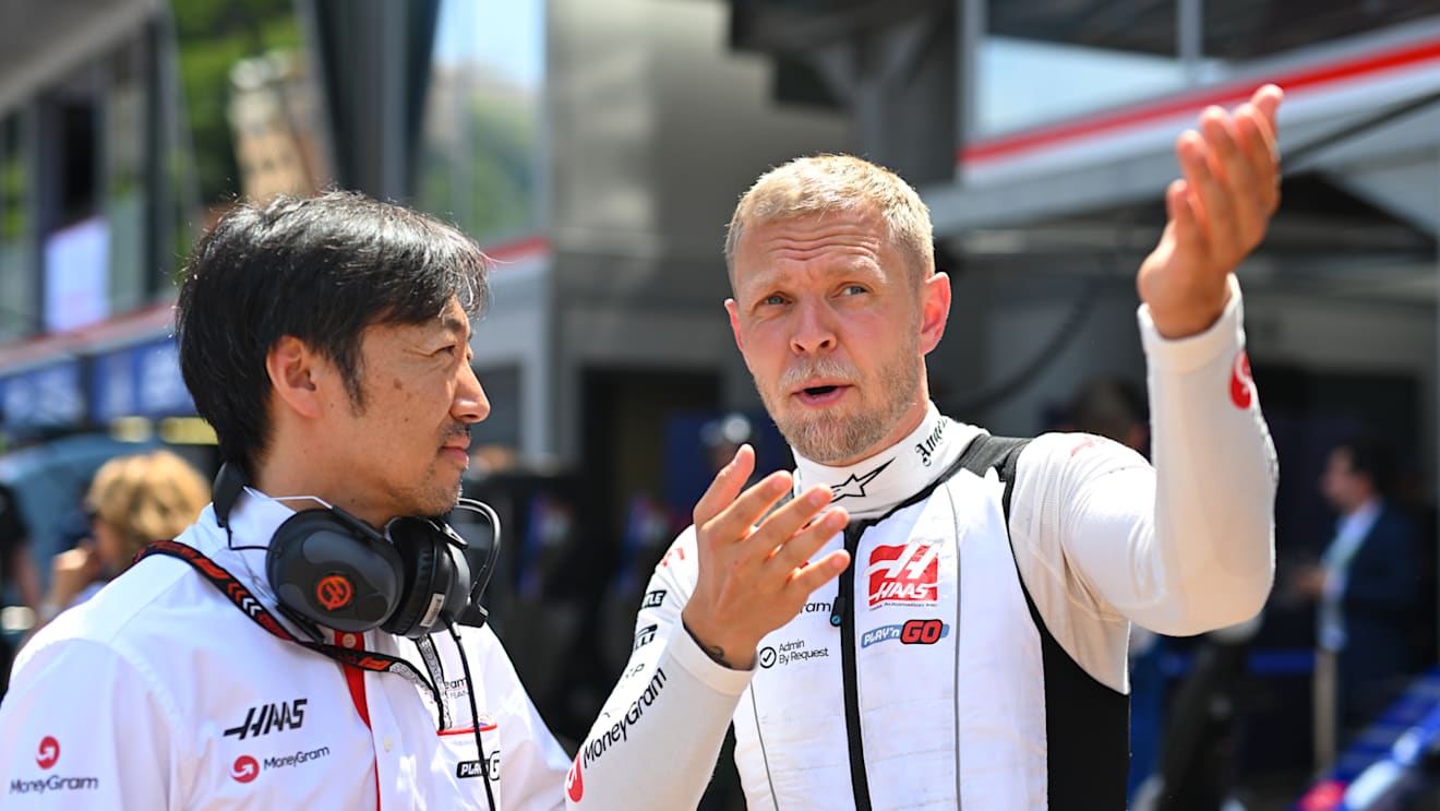 MONTE-CARLO, MONACO - MAY 26: Kevin Magnussen of Denmark and Haas F1 talks with Haas F1 Team Principal Ayao Komatsu on the grid prior to the F1 Grand Prix of Monaco at Circuit de Monaco on May 26, 2024 in Monte-Carlo, Monaco. (Photo by Rudy Carezzevoli/Getty Images)