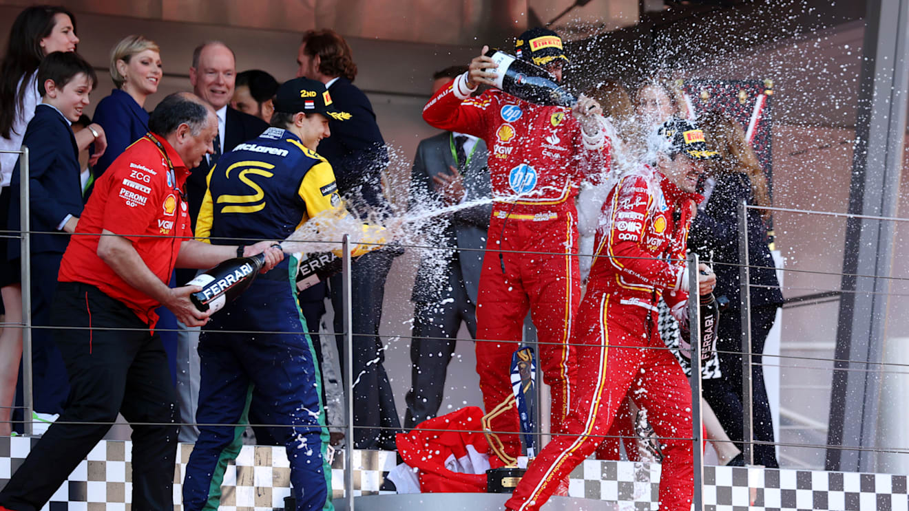 MONTE-CARLO, MONACO - MAY 26: Race winner Charles Leclerc of Monaco and Ferrari, Second placed Second placed Oscar Piastri of Australia and McLaren, Third placed Carlos Sainz of Spain and Ferrari and Ferrari Team Principal Frederic Vasseur celebrate on the podium during the F1 Grand Prix of Monaco at Circuit de Monaco on May 26, 2024 in Monte-Carlo, Monaco. (Photo by Ryan Pierse/Getty Images)