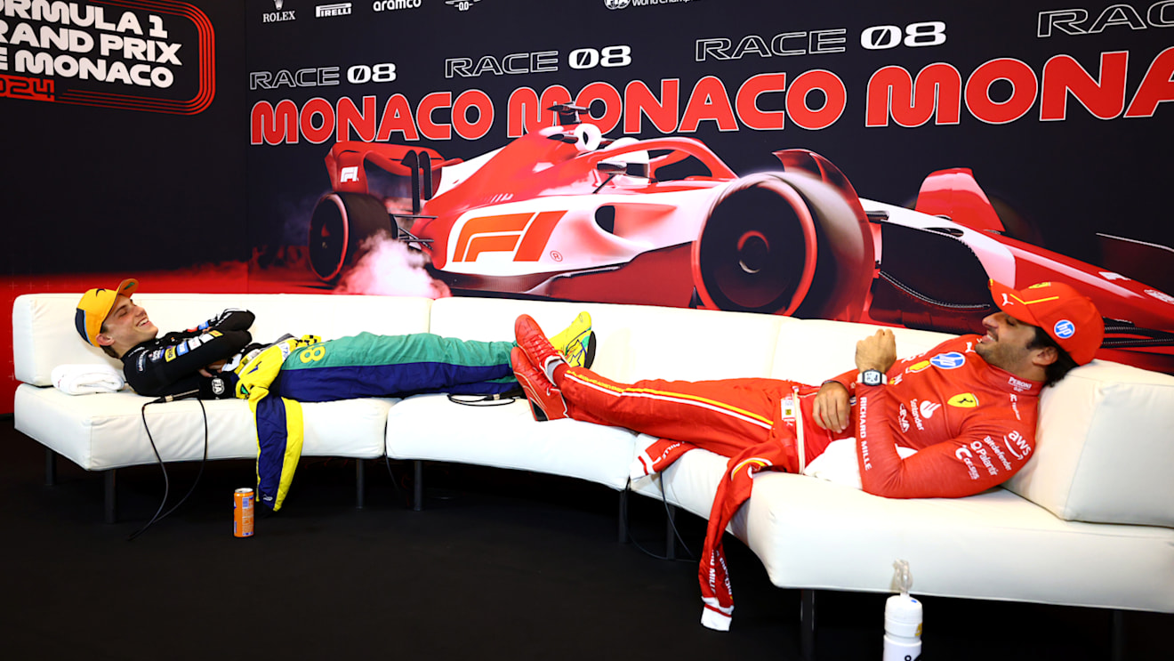 MONTE-CARLO, MONACO - MAY 26: Second placed Oscar Piastri of Australia and McLaren and Third placed Carlos Sainz of Spain and Ferrari wait for Race winner Charles Leclerc of Monaco and Ferrari to arrive in the press conference after the F1 Grand Prix of Monaco at Circuit de Monaco on May 26, 2024 in Monte-Carlo, Monaco. (Photo by Clive Rose/Getty Images)