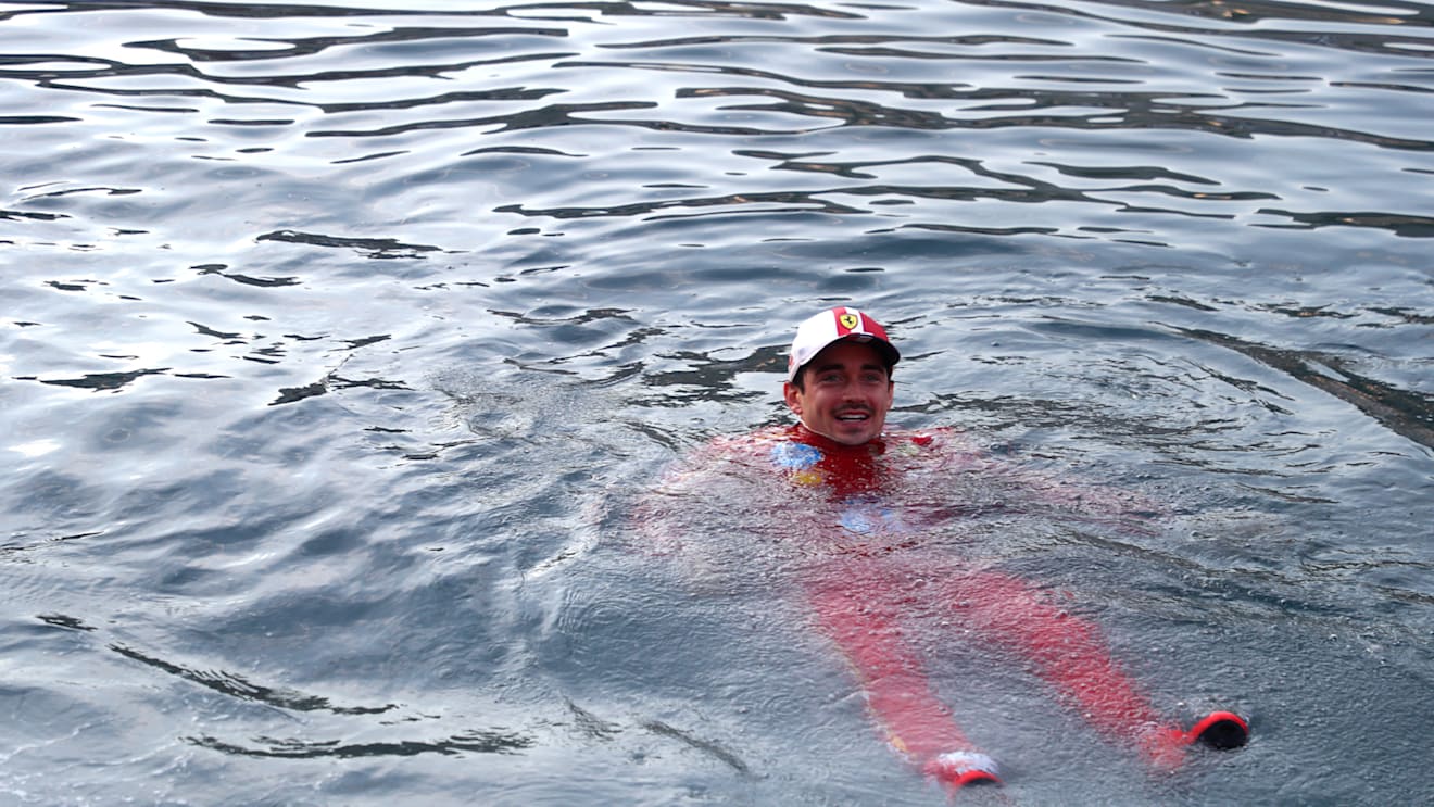 MONTE-CARLO, MONACO - MAY 26: Race winner Charles Leclerc of Monaco and Ferrari celebrates by jumping in the harbour after the F1 Grand Prix of Monaco at Circuit de Monaco on May 26, 2024 in Monte-Carlo, Monaco. (Photo by Peter Fox - Formula 1/Formula 1 via Getty Images)