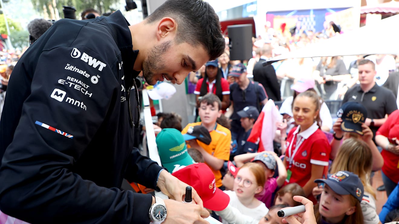 MONTE-CARLO, MONACO - MAY 24: Esteban Ocon of France and Alpine F1 signs autographs for fans in the fan stage prior to practice ahead of the F1 Grand Prix of Monaco at Circuit de Monaco on May 24, 2024 in Monte-Carlo, Monaco. (Photo by Peter Fox - Formula 1/Formula 1 via Getty Images)