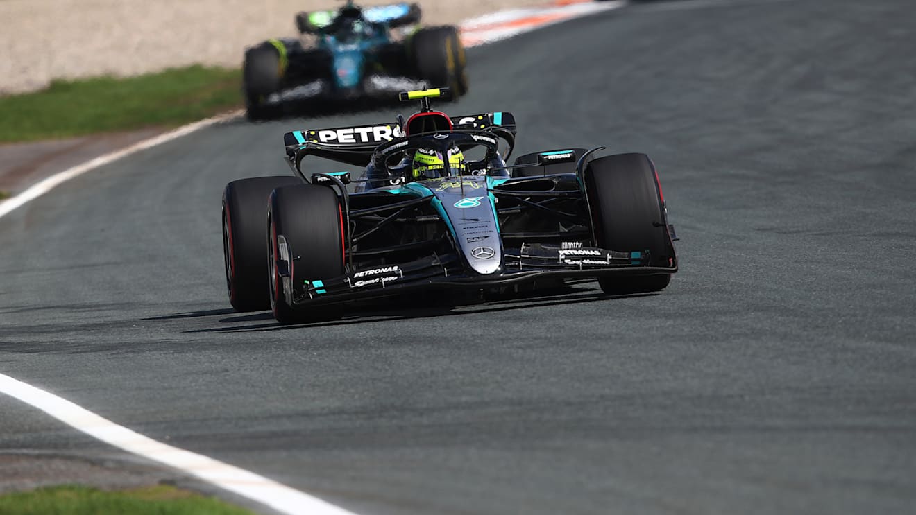 ZANDVOORT, NETHERLANDS - AUGUST 25: Lewis Hamilton of Great Britain driving the (44) Mercedes AMG Petronas F1 Team W15 leads Lance Stroll of Canada driving the (18) Aston Martin AMR24 Mercedes during the F1 Grand Prix of Netherlands at Circuit Zandvoort on August 25, 2024 in Zandvoort, Netherlands. (Photo by Joe Portlock/Getty Images)