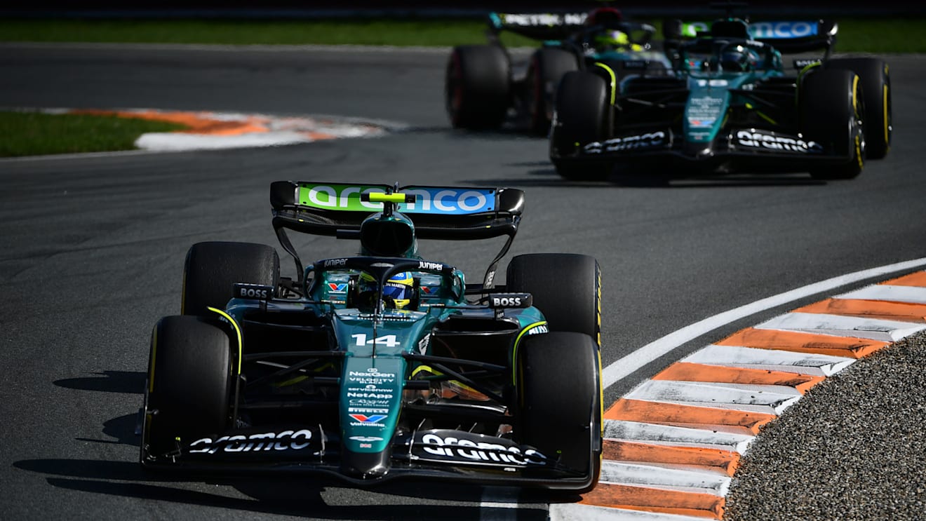 ZANDVOORT, NETHERLANDS - AUGUST 25: Fernando Alonso of Spain driving the (14) Aston Martin AMR24 Mercedes leads Lance Stroll of Canada driving the (18) Aston Martin AMR24 Mercedes during the F1 Grand Prix of Netherlands at Circuit Zandvoort on August 25, 2024 in Zandvoort, Netherlands. (Photo by James Sutton - Formula 1/Formula 1 via Getty Images)
