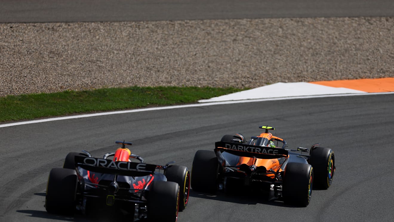 ZANDVOORT, NETHERLANDS - AUGUST 25: Lando Norris of Great Britain driving the (4) McLaren MCL38 Mercedes leads Max Verstappen of the Netherlands driving the (1) Oracle Red Bull Racing RB20 during the F1 Grand Prix of Netherlands at Circuit Zandvoort on August 25, 2024 in Zandvoort, Netherlands. (Photo by Bryn Lennon - Formula 1/Formula 1 via Getty Images)