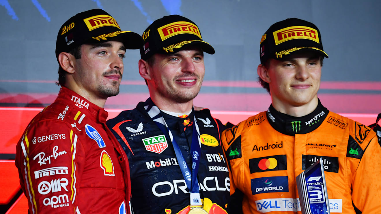 LUSAIL CITY, QATAR - DECEMBER 01: Race winner Max Verstappen of the Netherlands and Oracle Red Bull Racing (C), Second placed Charles Leclerc of Monaco and Ferrari (L) and Third placed Oscar Piastri of Australia and McLaren (R) celebrate on the podium during the F1 Grand Prix of Qatar at Lusail International Circuit on December 01, 2024 in Lusail City, Qatar. (Photo by James Sutton - Formula 1/Formula 1 via Getty Images)