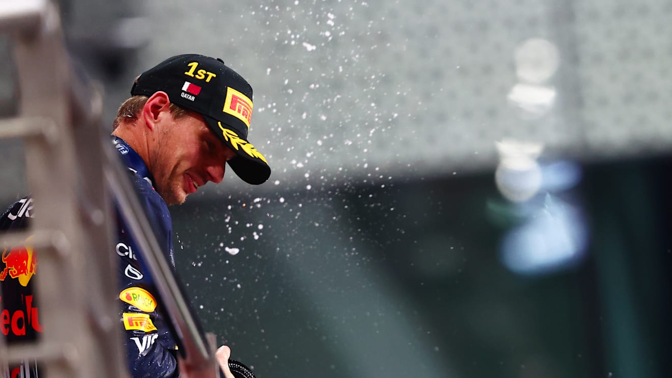 LUSAIL CITY, QATAR - DECEMBER 01: Race winner Max Verstappen of the Netherlands and Oracle Red Bull Racing celebrates on the podium during the F1 Grand Prix of Qatar at Lusail International Circuit on December 01, 2024 in Lusail City, Qatar. (Photo by Joe Portlock/Getty Images)