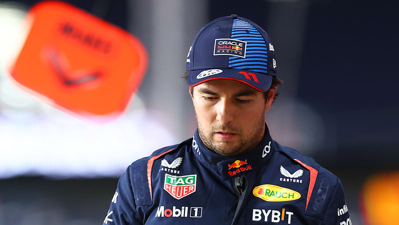 LUSAIL CITY, QATAR - NOVEMBER 29: 16th placed qualifier Sergio Perez of Mexico and Oracle Red Bull Racing walks in the Pitlane during Sprint Qualifying ahead of the F1 Grand Prix of Qatar at Lusail International Circuit on November 29, 2024 in Lusail City, Qatar. (Photo by Bryn Lennon - Formula 1/Formula 1 via Getty Images)