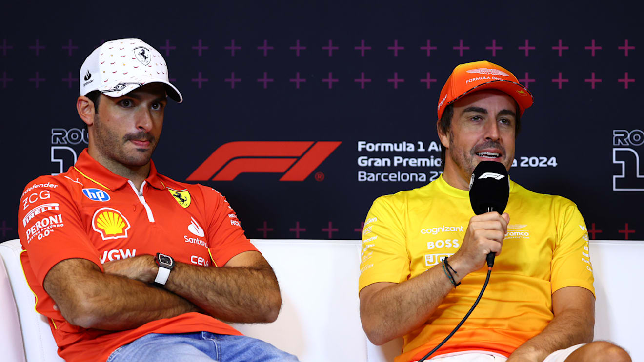 BARCELONA, SPAIN - JUNE 20: Carlos Sainz of Spain and Ferrari and Fernando Alonso of Spain and Aston Martin F1 Team attend the press conference during previews ahead of the F1 Grand Prix of Spain at Circuit de Barcelona-Catalunya on June 20, 2024 in Barcelona, Spain. (Photo by Clive Rose/Getty Images)