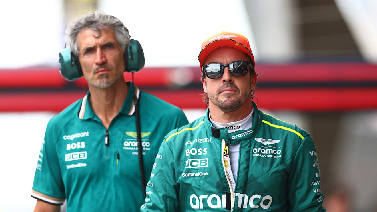 BARCELONA, SPAIN - JUNE 22: 11th placed qualifier Fernando Alonso of Spain and Aston Martin F1 Team walks in the Pitlane during qualifying ahead of the F1 Grand Prix of Spain at Circuit de Barcelona-Catalunya on June 22, 2024 in Barcelona, Spain. (Photo by Clive Rose - Formula 1/Formula 1 via Getty Images)