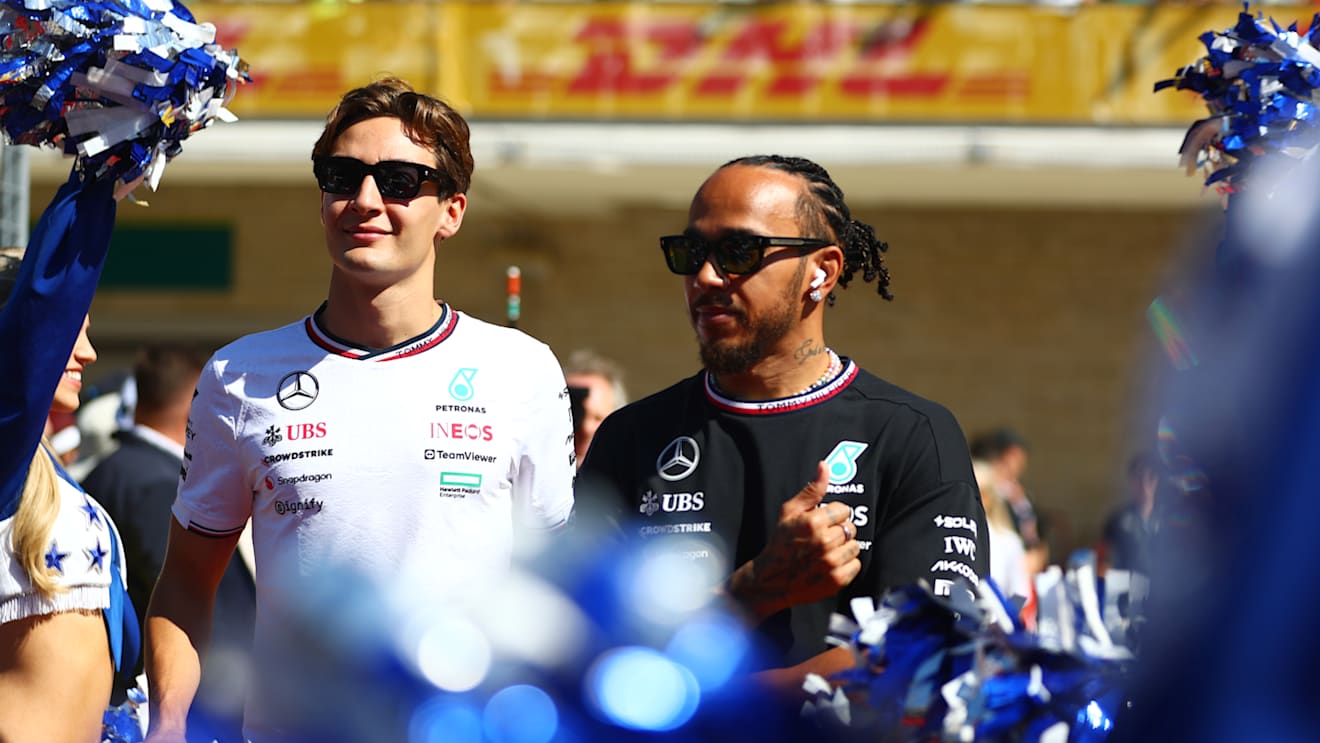 AUSTIN, TEXAS - OCTOBER 20: George Russell of Great Britain and Mercedes and Lewis Hamilton of Great Britain and Mercedes look on from the drivers parade prior to the F1 Grand Prix of United States at Circuit of The Americas on October 20, 2024 in Austin, Texas. (Photo by Peter Fox - Formula 1/Formula 1 via Getty Images)