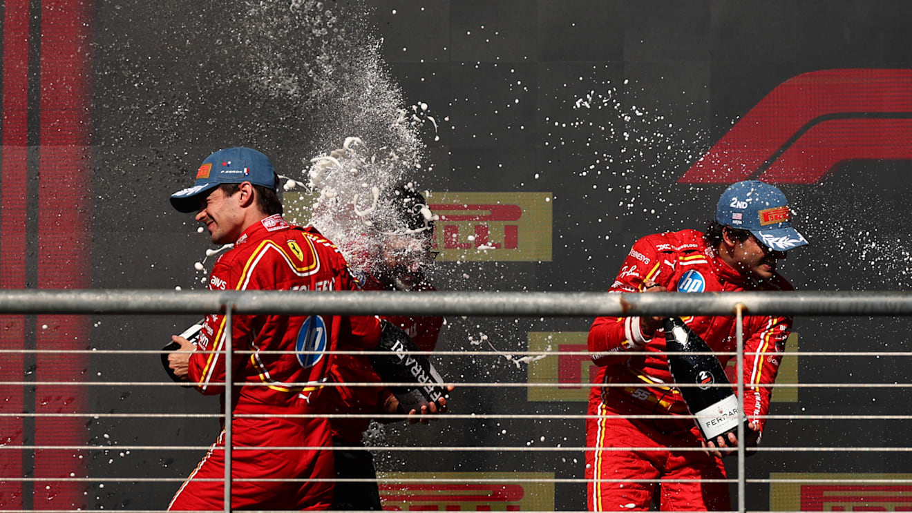 AUSTIN, TEXAS - OCTOBER 20: Race winner Charles Leclerc of Monaco and Ferrari and Second placed Carlos Sainz of Spain and Ferrari celebrate on the podium after the F1 Grand Prix of United States at Circuit of The Americas on October 20, 2024 in Austin, Texas. (Photo by Jared C. Tilton/Getty Images)