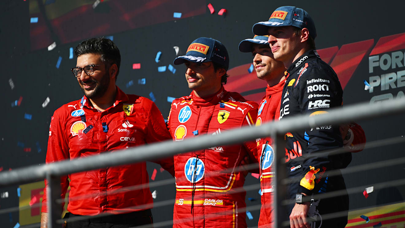 AUSTIN, TEXAS - OCTOBER 20: Race winner Charles Leclerc of Monaco and Ferrari, Second placed Carlos Sainz of Spain and Ferrari and Third placed Max Verstappen of the Netherlands and Oracle Red Bull Racing pose for a photo on the podium after the F1 Grand Prix of United States at Circuit of The Americas on October 20, 2024 in Austin, Texas. (Photo by Rudy Carezzevoli/Getty Images)