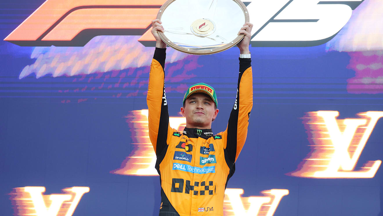 MELBOURNE, AUSTRALIA - MARCH 16: Race winner Lando Norris of Great Britain and McLaren lifts his trophy on the podium during the F1 Grand Prix of Australia at Albert Park Grand Prix Circuit on March 16, 2025 in Melbourne, Australia. (Photo by Mark Thompson/Getty Images)