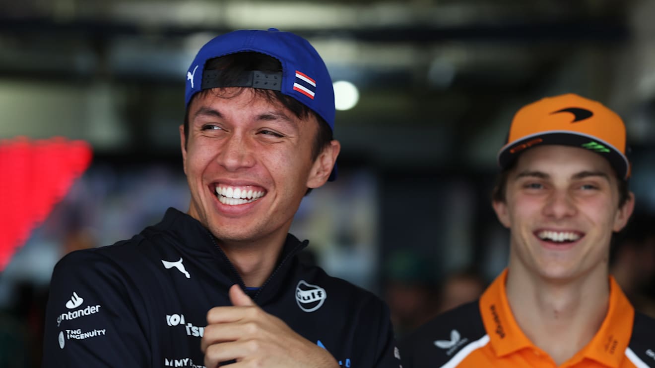 SHANGHAI, CHINA - MARCH 23: Alexander Albon of Thailand and Williams with Oscar Piastri of Australia and McLaren prior to the F1 Grand Prix of China at Shanghai International Circuit on March 23, 2025 in Shanghai, China. (Photo by Mark Thompson/Getty Images)