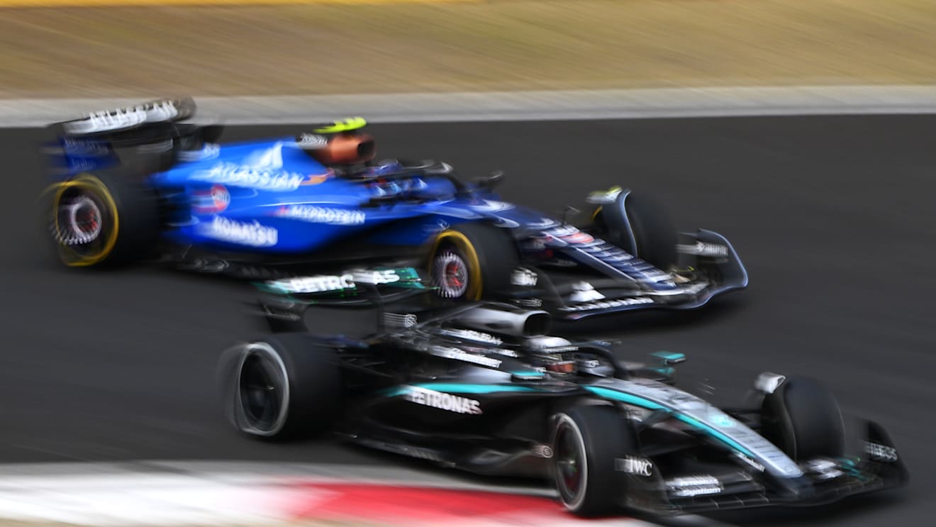 SHANGHAI, CHINA - MARCH 23: George Russell of Great Britain driving the (63) Mercedes AMG Petronas F1 Team W16 leads Carlos Sainz of Spain driving the (55) Williams FW47 Mercedes on track during the F1 Grand Prix of China at Shanghai International Circuit on March 23, 2025 in Shanghai, China. (Photo by Clive Mason/Getty Images)
