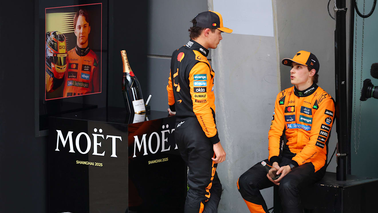 SHANGHAI, CHINA - MARCH 23: Second placed Lando Norris of Great Britain and McLaren and Race winner Oscar Piastri of Australia and McLaren talk in parc ferme during the F1 Grand Prix of China at Shanghai International Circuit on March 23, 2025 in Shanghai, China. (Photo by Clive Rose/Getty Images)