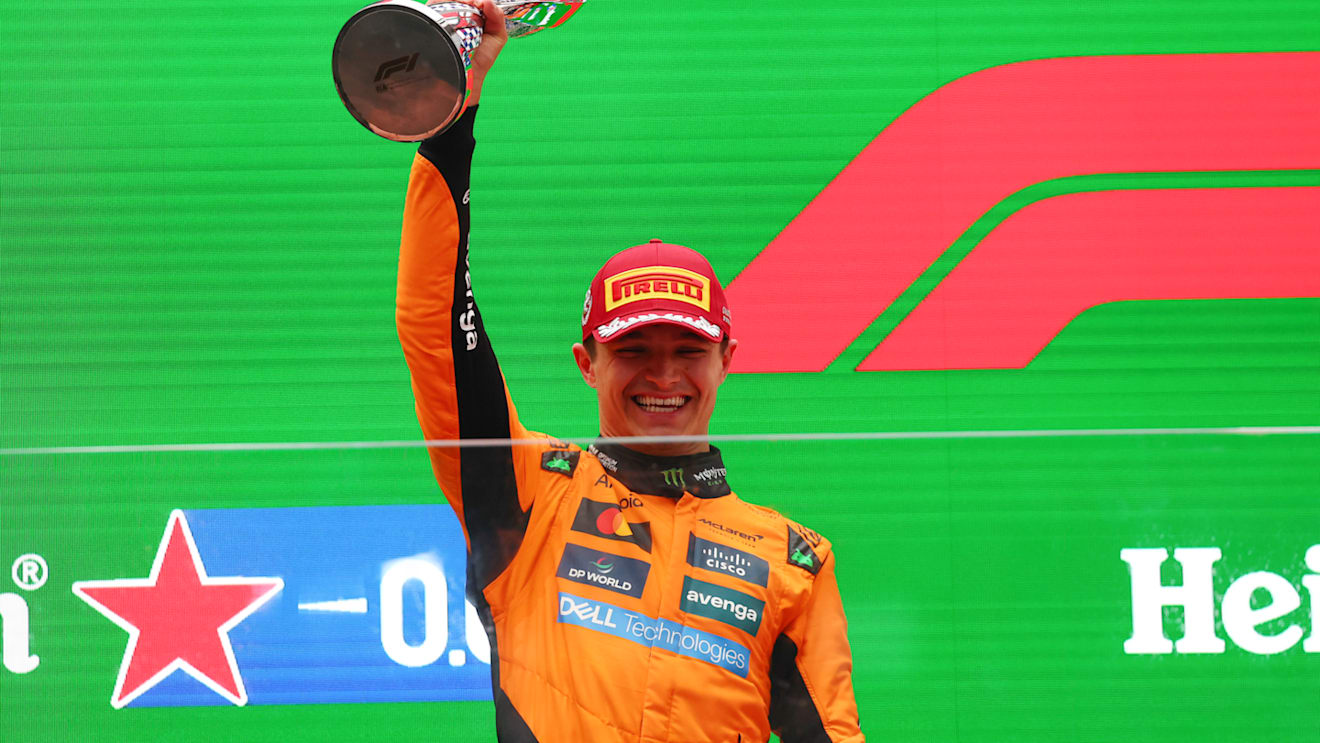 SHANGHAI, CHINA - MARCH 23: Second placed Lando Norris of Great Britain and McLaren lifts his trophy on the podium during the F1 Grand Prix of China at Shanghai International Circuit on March 23, 2025 in Shanghai, China. (Photo by Clive Rose/Getty Images)