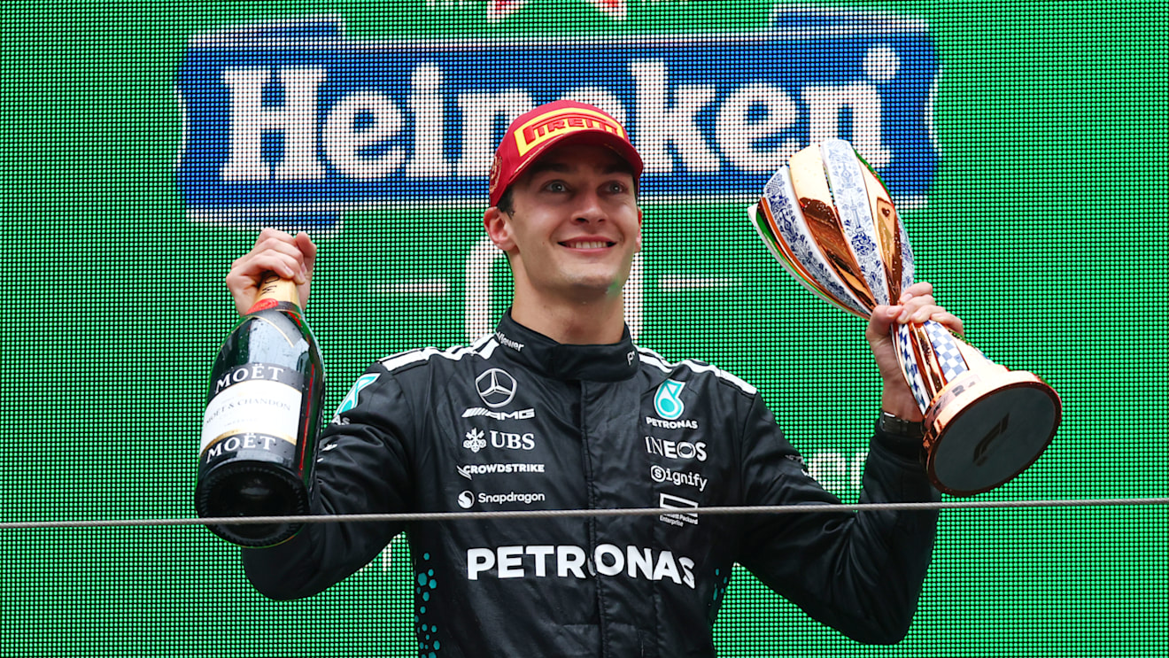 SHANGHAI, CHINA - MARCH 23: Third placed George Russell of Great Britain and Mercedes AMG Petronas F1 Team on the podium with his trophy during the F1 Grand Prix of China at Shanghai International Circuit on March 23, 2025 in Shanghai, China. (Photo by Clive Rose/Getty Images)
