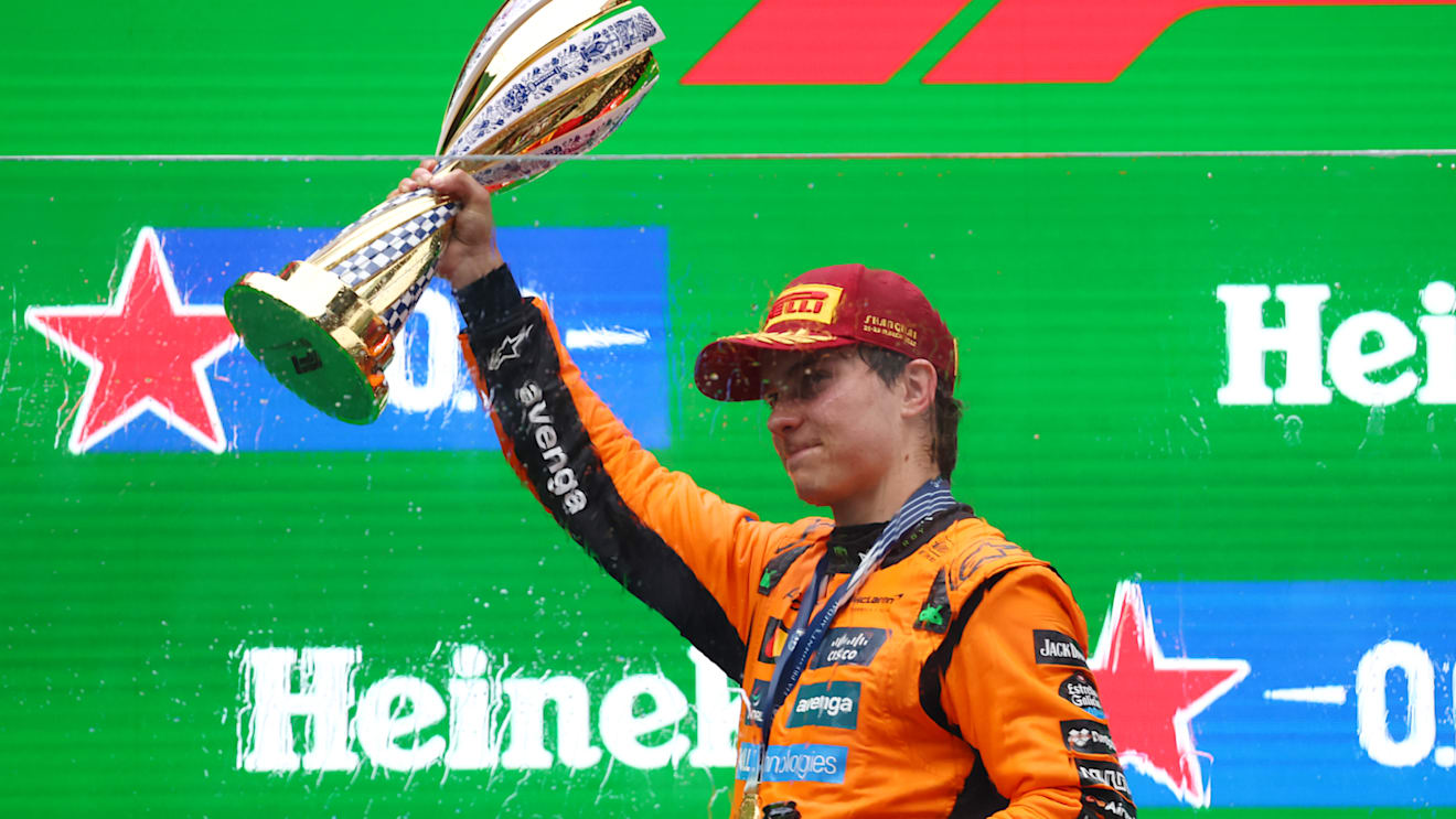 SHANGHAI, CHINA - MARCH 23: Race winner Oscar Piastri of Australia and McLaren lifts his trophy on the podium during the F1 Grand Prix of China at Shanghai International Circuit on March 23, 2025 in Shanghai, China. (Photo by Clive Rose/Getty Images)