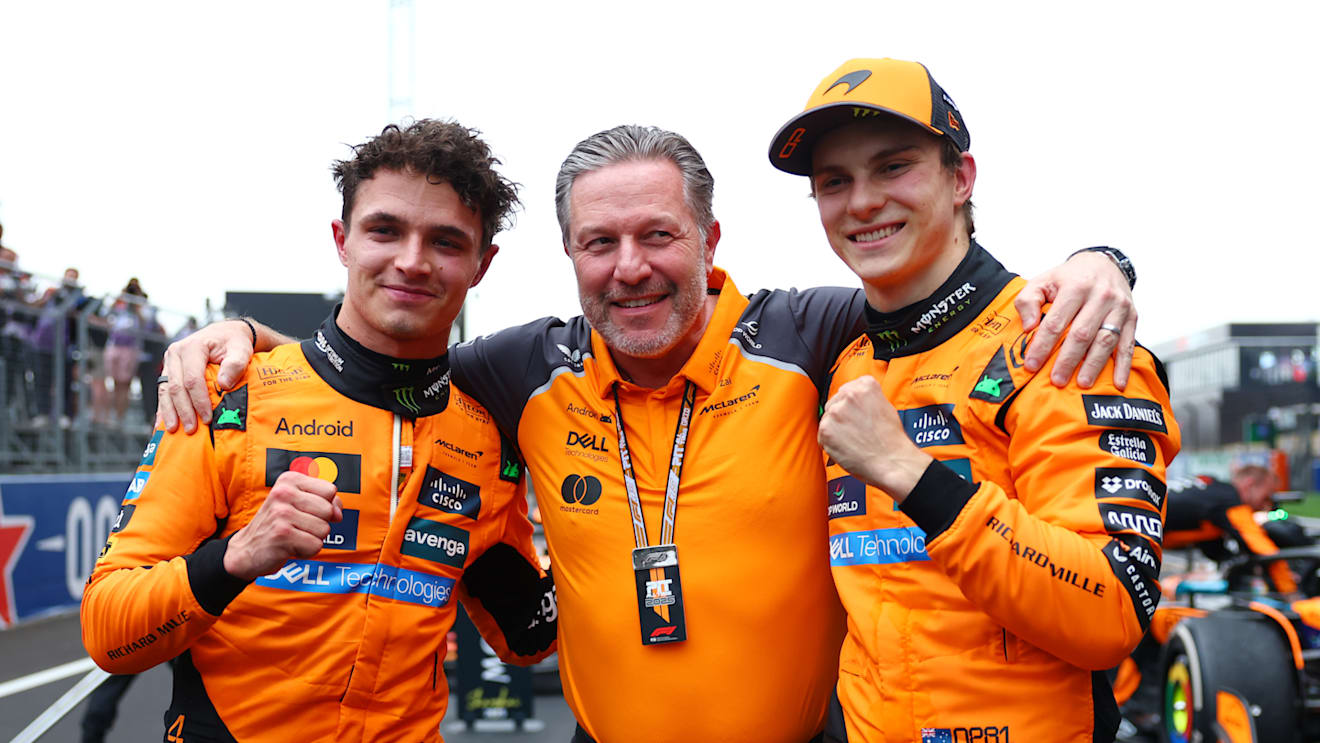 SHANGHAI, CHINA - MARCH 23: Second placed Lando Norris of Great Britain and McLaren Zak Brown, Chief Executive Officer of McLaren and Race winner Oscar Piastri of Australia and McLaren celebrate in parc ferme during the F1 Grand Prix of China at Shanghai International Circuit on March 23, 2025 in Shanghai, China. (Photo by Bryn Lennon - Formula 1/Formula 1 via Getty Images)