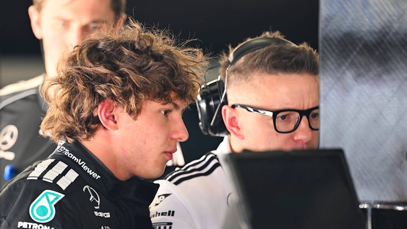 SHANGHAI, CHINA - MARCH 21: Andrea Kimi Antonelli of Italy and Mercedes AMG Petronas F1 Team talks with Peter Bonnington, Race Engineer of Mercedes AMG Petronas F1 Team in the garage during practice ahead of the F1 Grand Prix of China at Shanghai International Circuit on March 21, 2025 in Shanghai, China. (Photo by Mark Sutton - Formula 1/Formula 1 via Getty Images)
