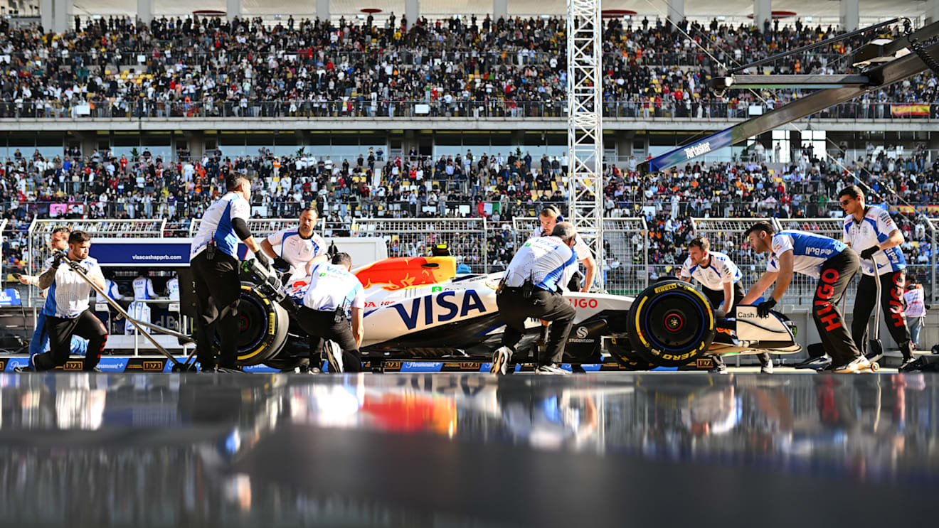 SHANGHAI, CHINA - MARCH 21: Mechanics in the Pitlane with Yuki Tsunoda of Japan driving the (22) Visa Cash App Racing Bulls VCARB 02 during Sprint Qualifying ahead of the F1 Grand Prix of China at Shanghai International Circuit on March 21, 2025 in Shanghai, China. (Photo by Rudy Carezzevoli/Getty Images)