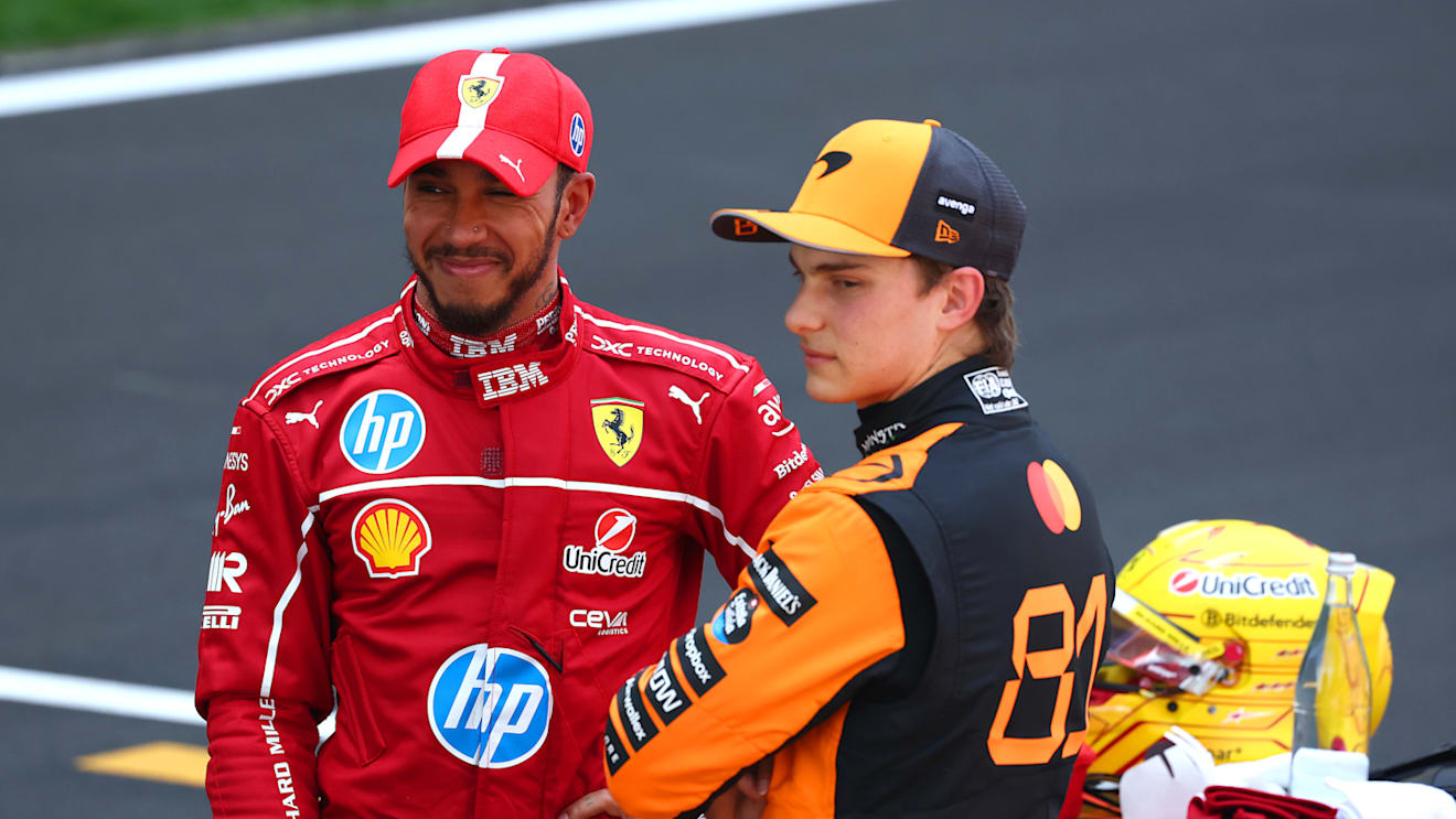 SHANGHAI, CHINA - MARCH 22: Sprint winner Lewis Hamilton of Great Britain and Scuderia Ferrari and Second placed Oscar Piastri of Australia and McLaren talk in parc ferme  during the Sprint ahead of the F1 Grand Prix of China at Shanghai International Circuit on March 22, 2025 in Shanghai, China. (Photo by Clive Rose/Getty Images)