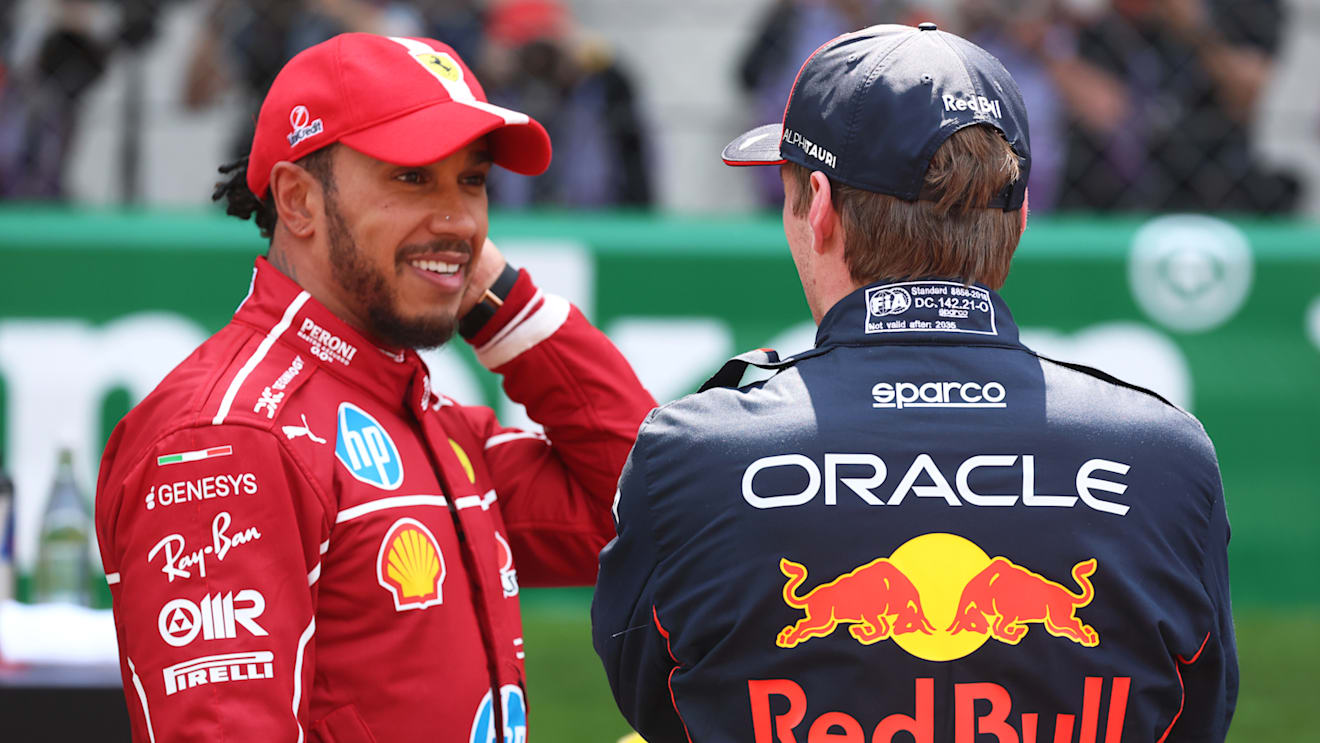 SHANGHAI, CHINA - MARCH 22: Sprint winner Lewis Hamilton of Great Britain and Scuderia Ferrari and Third placed Max Verstappen of the Netherlands and Oracle Red Bull Racing talk in parc ferme during the Sprint ahead of the F1 Grand Prix of China at Shanghai International Circuit on March 22, 2025 in Shanghai, China. (Photo by Mark Thompson/Getty Images)