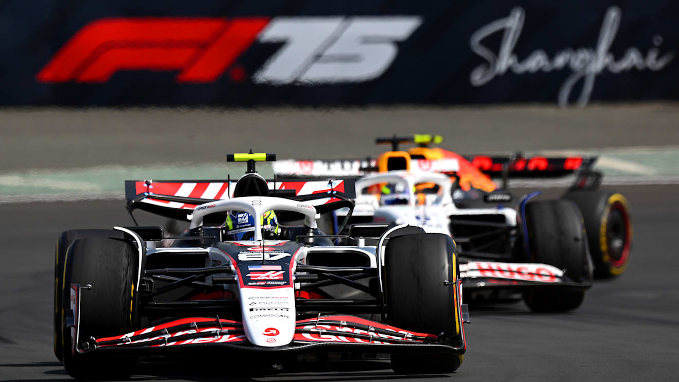 SHANGHAI, CHINA - MARCH 22: Oliver Bearman of Great Britain driving the (87) Haas F1 VF-25 Ferrari leads Isack Hadjar of France driving the (6) Visa Cash App Racing Bulls VCARB 02 on track  during the Sprint ahead of the F1 Grand Prix of China at Shanghai International Circuit on March 22, 2025 in Shanghai, China. (Photo by Clive Mason/Getty Images)