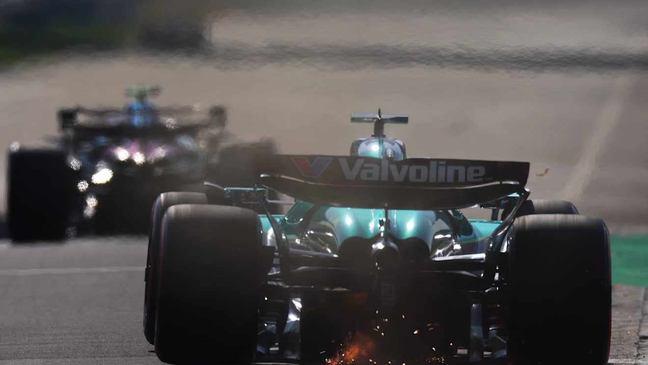 SHANGHAI, CHINA - MARCH 22: Sparks fly behind Lance Stroll of Canada driving the (18) Aston Martin F1 Team AMR25 Mercedes on track during qualifying ahead of the F1 Grand Prix of China at Shanghai International Circuit on March 22, 2025 in Shanghai, China. (Photo by Mark Thompson/Getty Images)