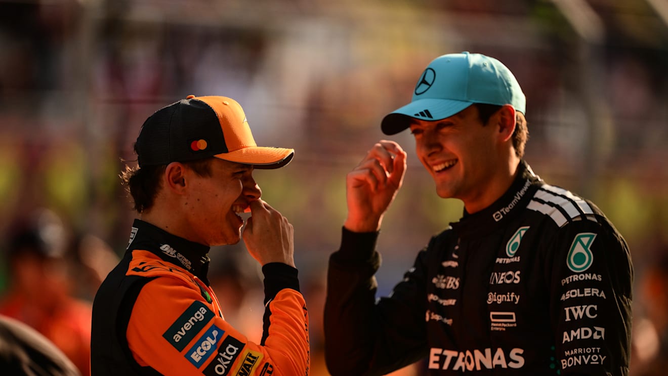 SHANGHAI, CHINA - MARCH 22: Third placed qualifier Lando Norris of Great Britain and McLaren and Second placed qualifier George Russell of Great Britain and Mercedes AMG Petronas F1 Team talk in parc ferme during qualifying ahead of the F1 Grand Prix of China at Shanghai International Circuit on March 22, 2025 in Shanghai, China. (Photo by Mario Renzi - Formula 1/Formula 1 via Getty Images)