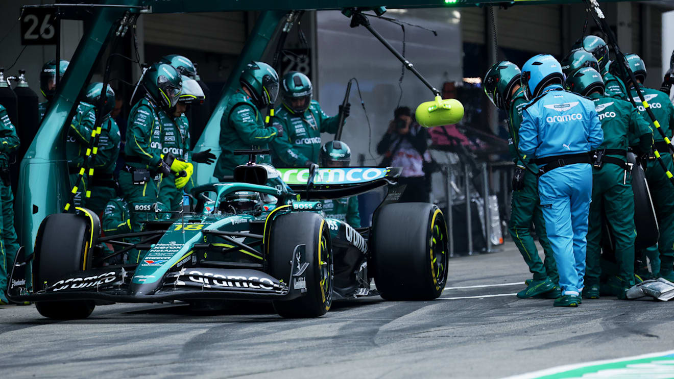 SUZUKA, JAPAN - APRIL 06: Lance Stroll of Canada driving the (18) Aston Martin F1 Team AMR25 Mercedes makes a pitstop during the F1 Grand Prix of Japan at Suzuka Circuit on April 06, 2025 in Suzuka, Japan. (Photo by Mark Thompson/Getty Images)