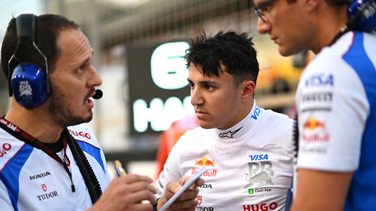 BAHRAIN, BAHRAIN - APRIL 13: Isack Hadjar of France and Visa Cash App Racing Bulls on the grid with engineers during the F1 Grand Prix of Bahrain at Bahrain International Circuit on April 13, 2025 in Bahrain, Bahrain. (Photo by Rudy Carezzevoli/Getty Images)