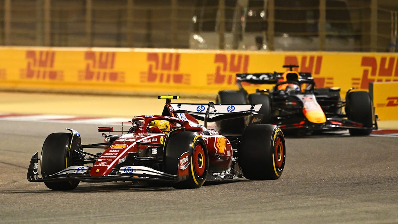 BAHRAIN, BAHRAIN - APRIL 13: Lewis Hamilton of Great Britain driving the (44) Scuderia Ferrari SF-25 leads Max Verstappen of the Netherlands driving the (1) Oracle Red Bull Racing RB21 on track during the F1 Grand Prix of Bahrain at Bahrain International Circuit on April 13, 2025 in Bahrain, Bahrain. (Photo by Clive Mason/Getty Images)