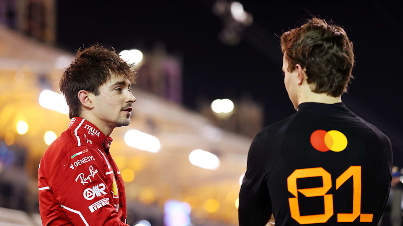 BAHRAIN, BAHRAIN - APRIL 12: Pole position qualifier Oscar Piastri of Australia and McLaren talks with Third placed qualifier Charles Leclerc of Monaco and Scuderia Ferrari in parc ferme during qualifying ahead of the F1 Grand Prix of Bahrain at Bahrain International Circuit on April 12, 2025 in Bahrain, Bahrain. (Photo by Bryn Lennon - Formula 1/Formula 1 via Getty Images)